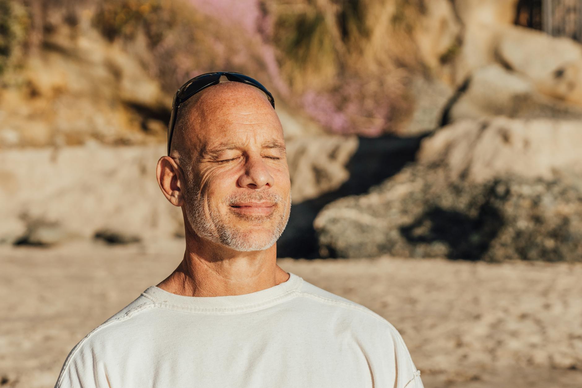 a man sitting on the sand